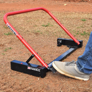 foot pressing the pedal to reset the Holeshot Starting Gate by Risk Racing