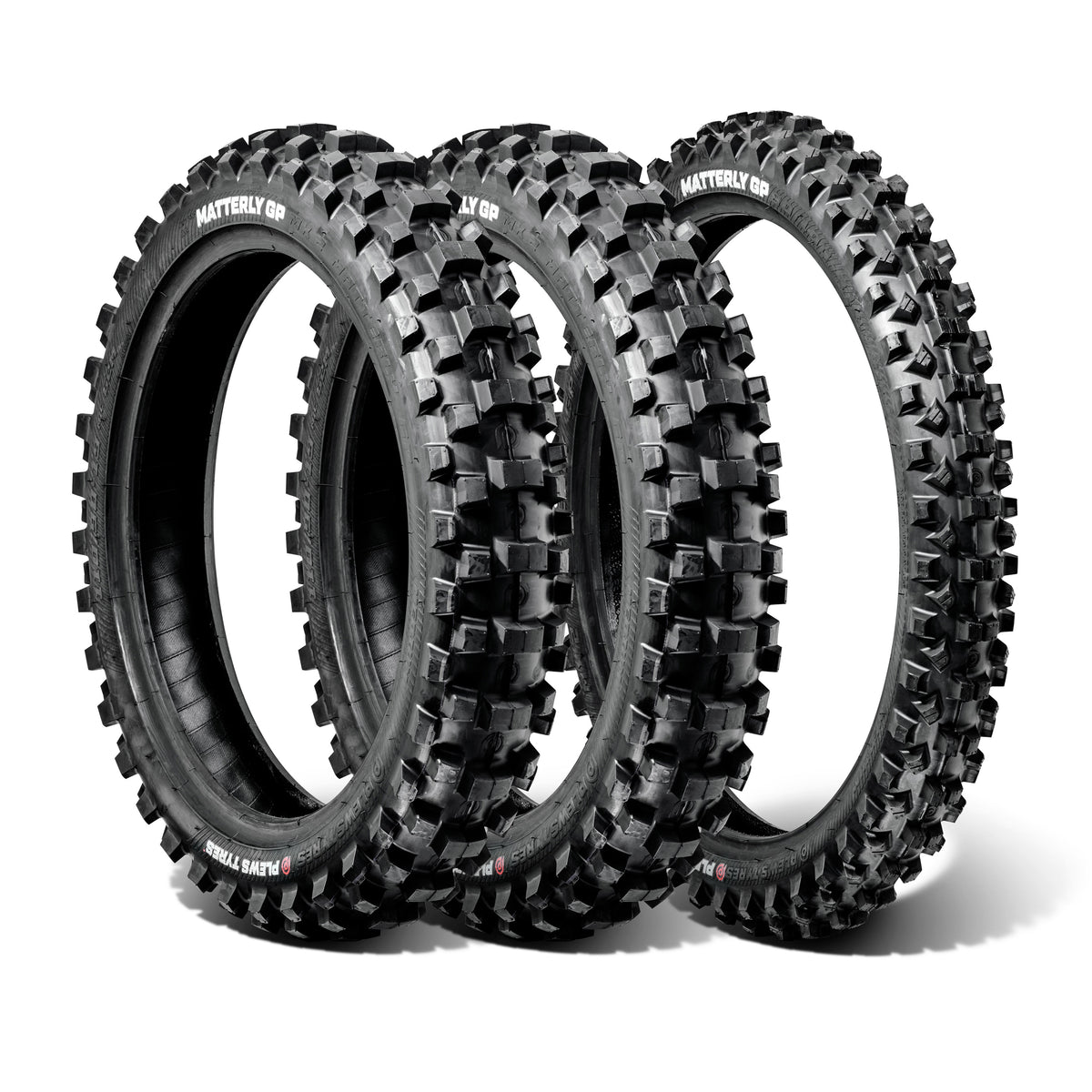 Three off-road dirt bike tires with knobby treads on a white background