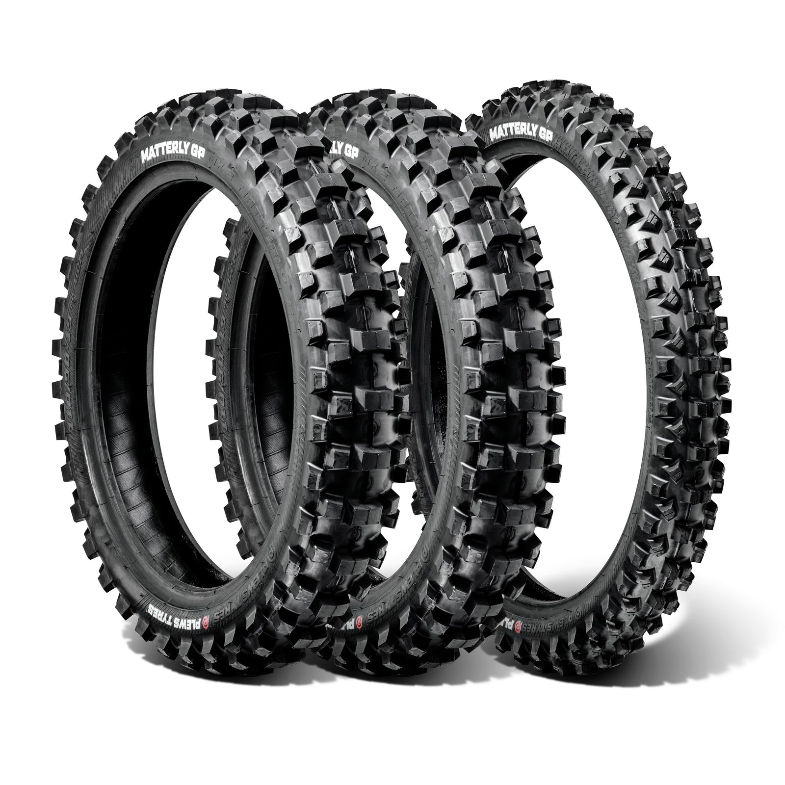 Three off-road dirt bike tires with knobby treads on a white background